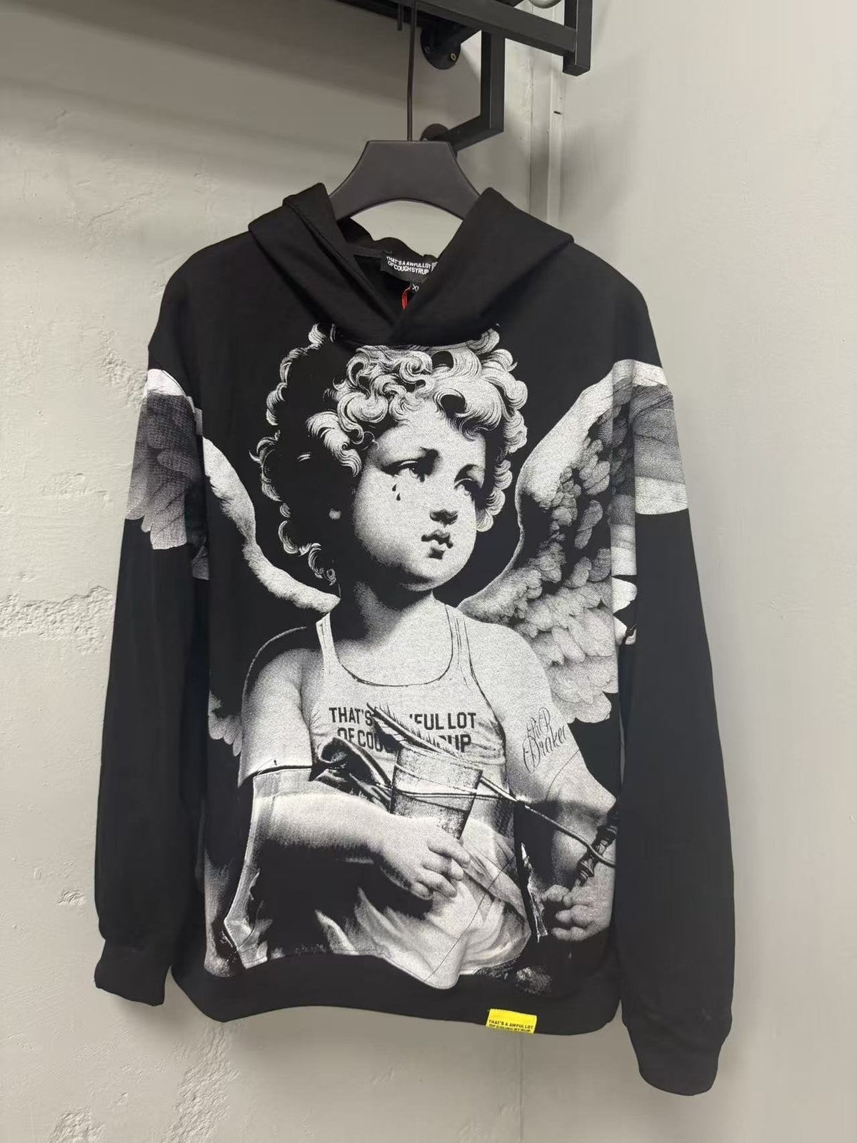 THAT'S A AWFUL LOT OF COUGH SYRUP Angel Tears Graphic Hoodie — front